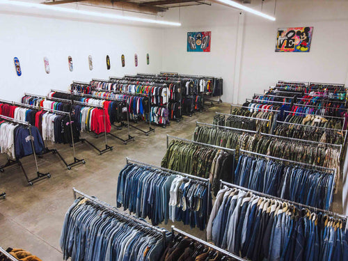 Wholesale vintage clothing racks inside ORA Industries warehouse in Gardena, California